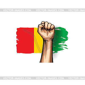 Guinea flag and hand - vector image