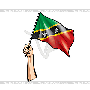 Saint Kitts and Nevis flag and hand - vector clip art