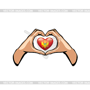 Montenegro flag and hand - vector clipart