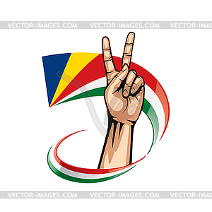 Seychelles flag and hand - vector clip art