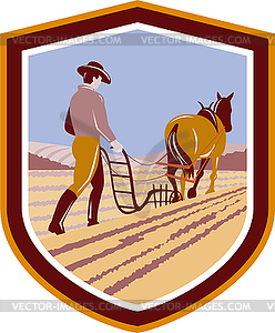 Farmer and Horse Plowing Farm Field Crest Retro - vector clipart