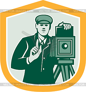 Photographer Shooting Vintage Camera Shield Retro - vector clipart