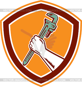 Hand Holding Adjustable Wrench Shield Woodcut - vector clipart