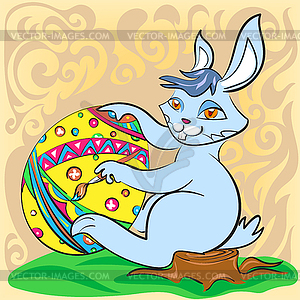 Easter bunny with big egg and brush - vector clipart