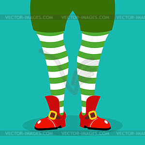 Leg Christmas elf. Striped stockings and red - vector clipart