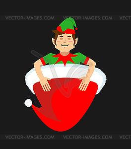 Santa cap and elf. Little Claus assistant. Christma - vector image