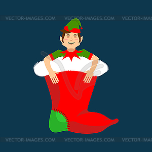 Christmas stocking and Santa Elf. Little Claus - vector clip art