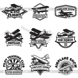Set of flying academy emblems. Vintage airplanes. - vector image