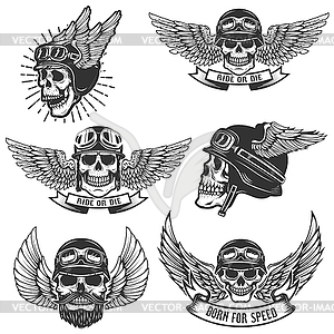 Set of skulls in winged motorcycle helmets. Design - vector clipart