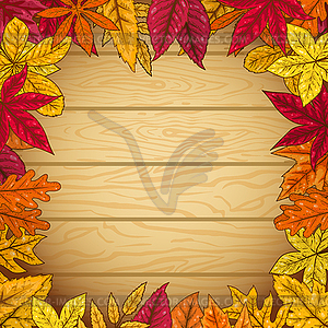 Border of autumn leaves on wooden background - vector clip art