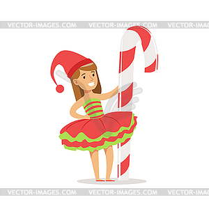 Girl With Giant Candy Cane Stick Dressed As Santa - vector EPS clipart