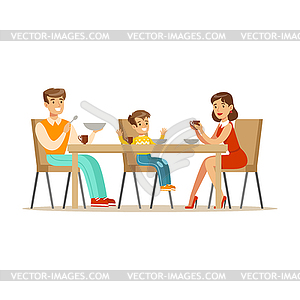 Mom, Dad And Son Having Breakfast , Happy Family - vector clipart