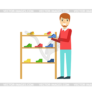 Smiling man holding shoe in shoe store, colorful - vector image