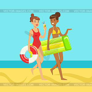 Two young women walking on beach holding lifebuoy - vector image