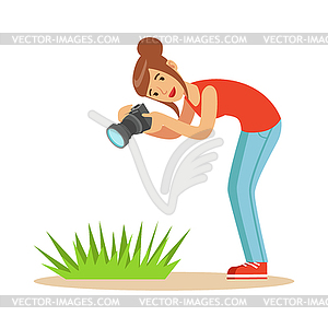 Beatuful woman taking picture of green grass with - vector clip art
