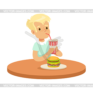 Cute boy drinking soda through straw and eating - vector image