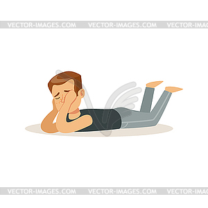 Frustrated boy character lying on his stomach on - vector image