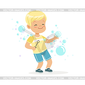 Cute little blonde boy playing bubbles - vector image