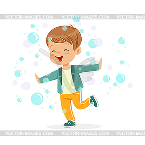 Cute happy little boy playing bubbles - vector image