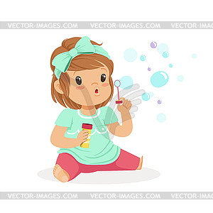 Adorable little girl sitting blowing bubbles - vector clipart