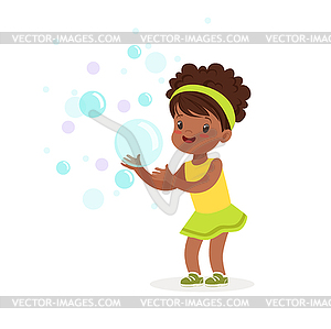 Cute smiling little girl playing bubbles - vector clipart