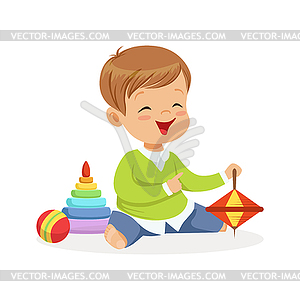 Adorable happy little boy sitting on floor playing - vector image