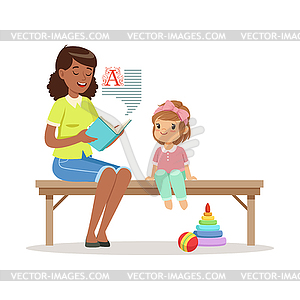 Teacher reading book to little girl sitting on - vector clipart