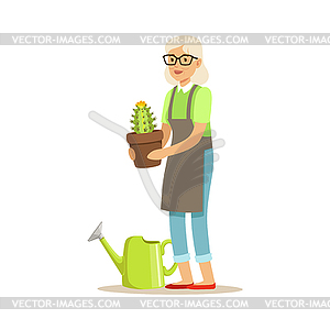 Active senior woman planting cactus in pot - vector clip art