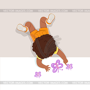 Little boy lying on his stomach and painting - vector image