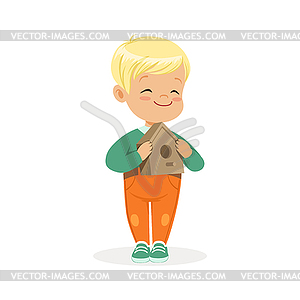 Cute smiling little boy standing and holding - vector clipart