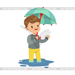 Cute little boy standing in puddle and holding - vector clipart