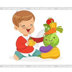 Smiling little boy sitting on floor playing with - vector clipart