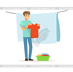 Young smiling man hanging wet clothes out to dry, - vector image