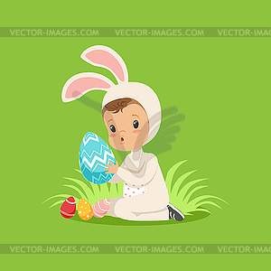 Sweet little baby in bunny costume sitting on - vector clip art