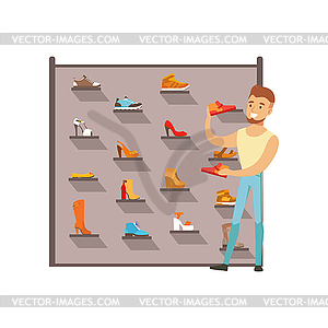 Man buying shoes in shoe store, male shopping in - vector clipart