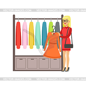 Женщина, выбирающая платье во время шопинга, красивый гир - клипарт Royalty-Free
