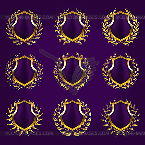Golden shields with laurel wreath - vector image