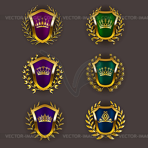 Golden shields with laurel wreath - vector image