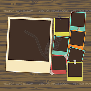 Photo frames on wooden background - vector clipart