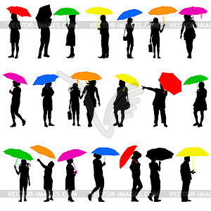 Set silhouettes of men and women with umbrellas. - vector clipart / vector image