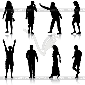 Black silhouette group of people standing in variou - vector clipart