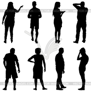 Black silhouette group of people standing in variou - royalty-free vector clipart