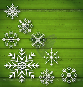 Set geometric snowflakes on wooden background - vector clip art