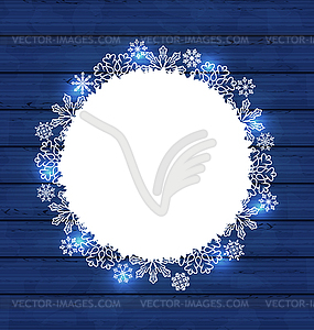 Christmas round frame made in snowflakes on blue - vector image