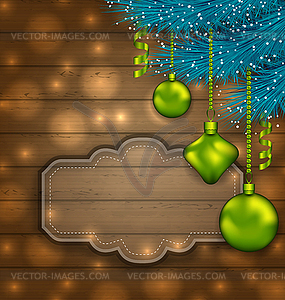 New Year label with balls and fir twigs on wooden - vector EPS clipart