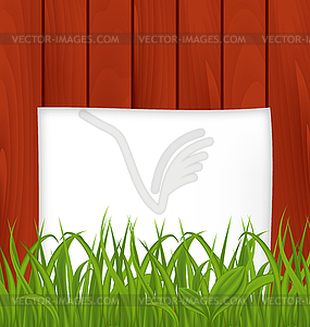 Paper sheet and green grass on wooden texture - vector image