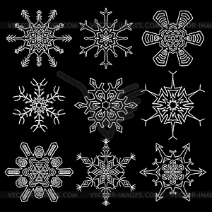 Set of drawn snowflake silhouettes - vector image