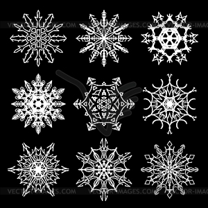 Set of drawn snowflake silhouettes - vector image