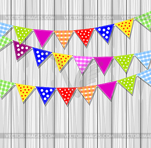 Festive small flags on background wooden texture - vector clipart / vector image