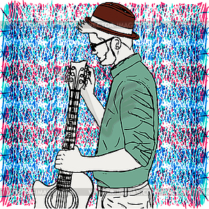 Young hipster man in hat with beard tunes guitar. - vector EPS clipart